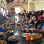 Children and staff enjoy food together